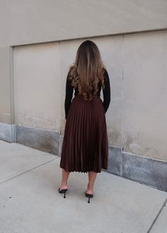 PRODUCT DETAILS: Dark brown pleated skirt Satin Midi length Elastic waistband True to size 100% Polyester Model is wearing a size Small Model Info: Height: 5'3", Bust: 36 3/4". Waist: 30", Hips: 38.5" MEASUREMENTS: Length: 31" Small: Waist: 13" Medium Waist: 14" Large Waist: 15" Brown Pleated Skirt, 24th Anniversary, Skirt Satin, Small Waist, Holiday Collection, Black Sweaters, Pleated Skirt, Midi Length, Denim Skirt