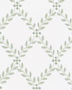 a white wallpaper with green leaves on it