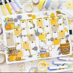 an open planner with honey themed items on it