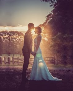 a bride and groom standing in front of the sun