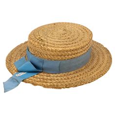 The Ridgemont Make's vintage 1930s boater hat showcases timeless elegance with its natural straw construction. Adorned with a pale blue ribbon and bow, this hat epitomizes classic style. The sturdy yet lightweight straw provides comfort and durability, while the charming ribbon adds a touch of sophistication. This boater hat captures the essence of vintage summer fashion, making it a coveted accessory for collectors and design enthusiasts alike. Seven are available for a display collection. Some Blue Ribbon Bow, Vintage Summer Fashion, Boater Hat, Makati, Ribbon Bow, Vintage Summer, Blue Ribbon, Ribbon Bows, Pale Blue