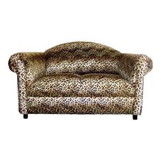 a leopard print couch sitting on top of a white background