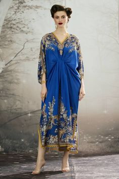 Blue silk kaftan with all over regal floral prints and narrow yellow panel work. - Aza Fashions Blue Maxi Length Kaftan With Dabka, Blue Long Kaftan With Dabka Detailing, Blue Bohemian Dress With Dabka, Blue Long Kaftan For Festive Occasions, Bohemian Blue Festive Maxi Dress, Blue Bohemian Maxi Dress For Festive Occasions, Festive Bohemian Blue Maxi Dress, Blue Traditional Drape Kaftan For Eid, Blue Kaftan For Eid With Traditional Drape