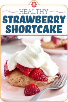 a strawberry shortcake with whipped cream on top and strawberries in the foreground