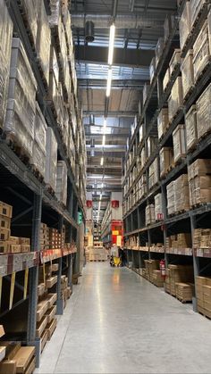 a large warehouse filled with lots of shelves and boxes on top of each shelf,