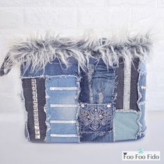 an old pair of jeans has been transformed into a patchwork basket with faux fur