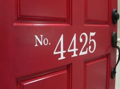 a red door with white numbers on it and no 4225 written on the side