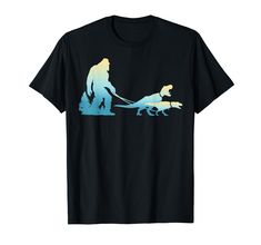 a t - shirt with an image of a dog pulling a man on a sled