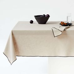 Warm Natural Merrow Stitch Organic Cotton Tablecloths | Crate & Barrel Modern Tablecloths, Colorful Dinnerware, Black Embroidery, White Table Cloth, Dining Table Black, Cotton Tablecloths, White Table, Dining Room Living Room, No Matter How