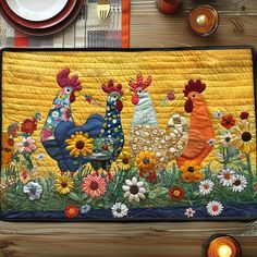 a place mat with roosters and flowers in the middle on a table next to candles