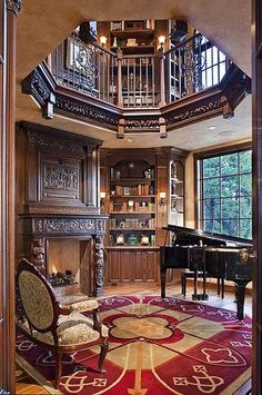 a grand piano is in the center of this living room with an ornate spiral staircase