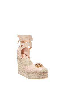 The Gucci collection is the pinnacle of Italian craftsmanship and attention to detail as seen in these dusty pink Leather platform espadrilles. Featuring an almond toe, a branded insole, a high wedge heel, a grosgrain lace-up closure and a gold-tone double G logo on the front.Round toeBraided raffia wedge heelTie-fastening ankle strapSignature interlocking GG logo Quilted finishComposition: Leather 100%, Raffia 100%Lining: Leather 100%Sole: Rubber 100%Made in Italy Gucci Leather Wedge Sandals For Summer, Chic Gucci Platform Wedge Sandals, Gucci Wedge Sandals With Platform Heel, Chic Gucci Summer Wedge Sandals, Luxury Pink Wedge Heel Sandals, Gucci Platform Wedge Sandals, Gucci Summer Wedge Heel Sandals, Chic High Heel Espadrilles With Woven Sole, Gucci Summer Wedge Sandals