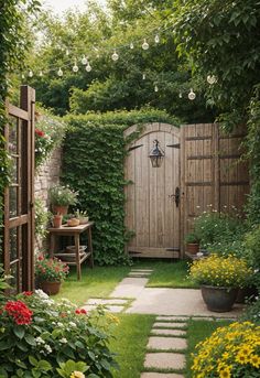 an outdoor garden with flowers and plants around the area, including a wooden door surrounded by greenery