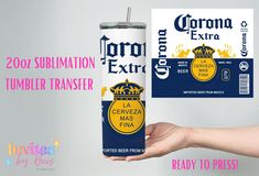 a can of corona extra beer being held by a woman's hand with the label next to it