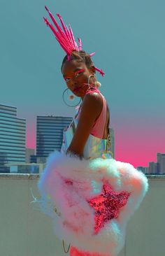 a girl with pink and white hair standing on top of a roof wearing a fluffy skirt