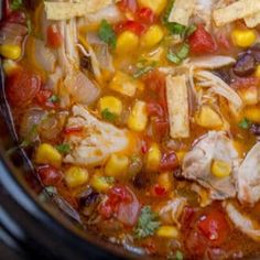 a bowl filled with chicken and corn soup