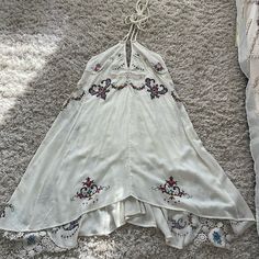 Stunning Vintage Fp Halter Dress Size Xs. Embroidered With Lace Detailing And Lining. Halter Tie With Scoop Back. Serious Offers Only. Excellent Condition White Bohemian Embroidered Mini Dress, Sleeveless Dress With Embroidered Hem For Festivals, Bohemian Sleeveless Mini Dress With Floral Embroidery, Sleeveless Embroidered Hem Dress For Festival, White Sleeveless Bohemian Embroidered Dress, White Bohemian Mini Dress With Floral Embroidery, Bohemian Dress With Floral Print And Handkerchief Hem, White Bohemian Sleeveless Embroidered Dress, Spring Bohemian Sleeveless Embroidered Dress