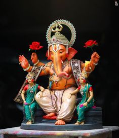 an elephant statue sitting on top of a table