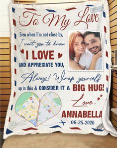 a personalized blanket hanging on the wall in front of a door with an image of a man and woman