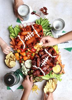 several people are eating football themed food