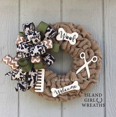 a burlock wreath with scissors and hair clips on it that says wash, welcome