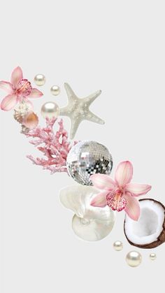 some pink flowers and pearls on a white background with a mirror ball in the middle