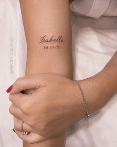 a woman's arm with a tattoo on it that reads, sabelle