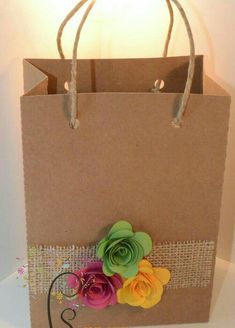 a paper bag with flowers on it