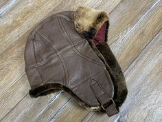 Stetson Aviator Trapper LEATHER Winter Hat Brown 1865  9227901 100% Authentic  100% Leather  Lining 76% Cotton 24% Polyester  Color 6 brown Size: L/XL Good condition, look at pictures Brown Leather Hats With Faux Fur Lining, Leather Winter Hat Fitted, Winter Leather Hat, Vintage Leather Winter Hats, Vintage Leather Hats For Winter, Fitted Leather Winter Hat, Green Rabbit, Trapper Hats, Concert Tshirts