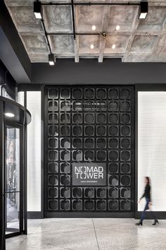 the entrance to an office building with black and white walls