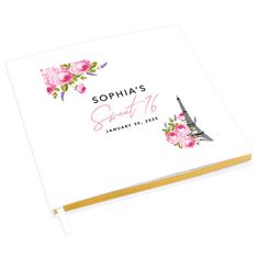 a personalized notebook with the eiffel tower in pink and yellow flowers on it