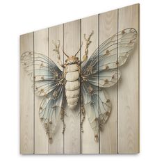 a wooden wall with a painting of a bug on it's back and wings