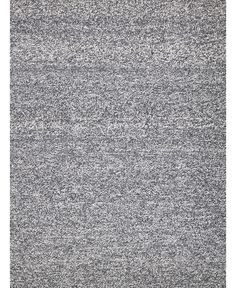 an area rug with grey and white colors