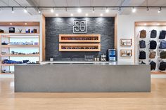 the inside of a shoe store with wooden floors