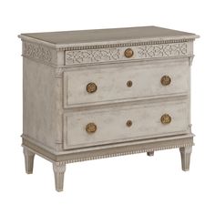 an antique white chest with two drawers and gold knobs on the front, against a white background