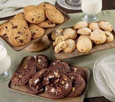 cookies, chocolate chip cookies and milk on a table