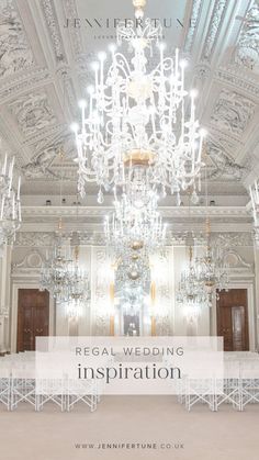 the chandelier is hanging from the ceiling above the tables in the room with white linens