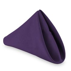 a purple napkin folded in the shape of a triangle