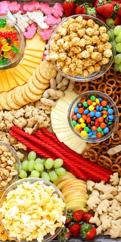 a platter filled with lots of different types of snacks and treats on top of each other