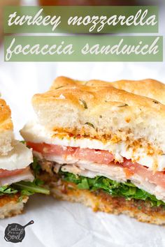 there is a sandwich cut in half on the paper with text overlay that reads turkey mozzarella focaccia sandwich