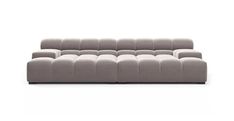 a gray couch sitting on top of a white floor