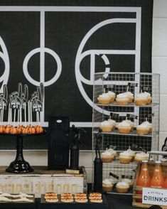 a table with cupcakes and drinks on it