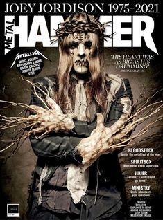 a man with long hair and makeup on the cover of a magazine