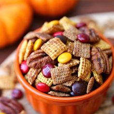 a bowl filled with cereal and nuts on top of a table