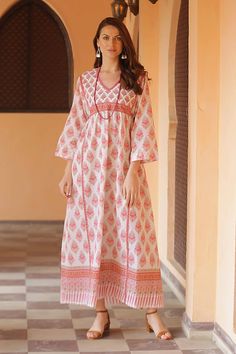 A pretty mix of prints in carnation pink melon and pistachio cover this appealing empire waist maxi dress from Aftab in India. The long flowy cotton dress features three-quarter length sleeves a v-neckline and ties at the side to adjust the fit. Feels like loungewear but looks pretty enough for a garden party! Flowy Cotton Dress, Empire Waist Maxi, Carnation Pink, Cotton Caftan, Empire Waist Maxi Dress, Wardrobe Fashion, Cotton Maxi Dress, Fashion Crafts, Lounge Dress