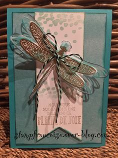 a card with a dragonfly on it