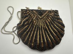 Beautiful Vintage Gold and Black Beaded Purse/Clutch/Handbag/Evening Bag Condition consistent with age and use. Please see photos for details. Antique Beaded Evening Bag, Antique Style Evening Clutch Bag, Accessory Design, Beaded Purses, Purse Clutch, Clutch Handbag, Black Beads, Vintage Gold, Evening Bags