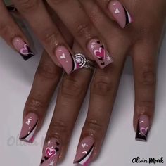 a woman's nails with hearts and stars on them