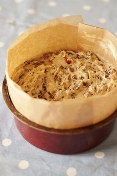 a bowl filled with food sitting on top of a table