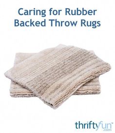 two white towels stacked on top of each other with the words caring for rubber backed throw rugs